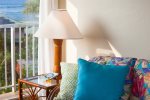 Colorful pillows add to tropical decor